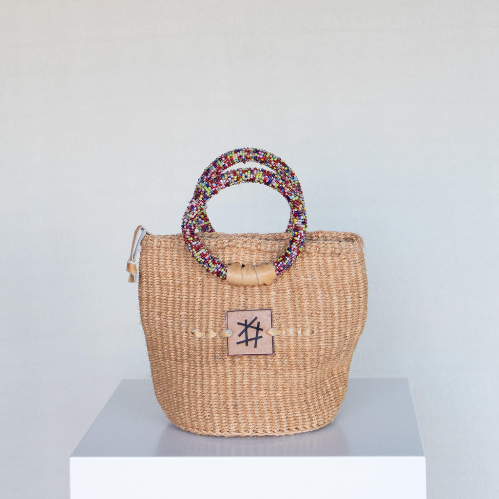 Liten veske med perlehåndtak