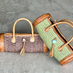 Sylinderveske håndlaget sisal og skinn fra Kenya