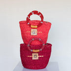 Liten veske med perlehåndtak