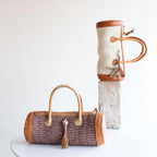 Sylinderveske håndlaget sisal og skinn fra Kenya