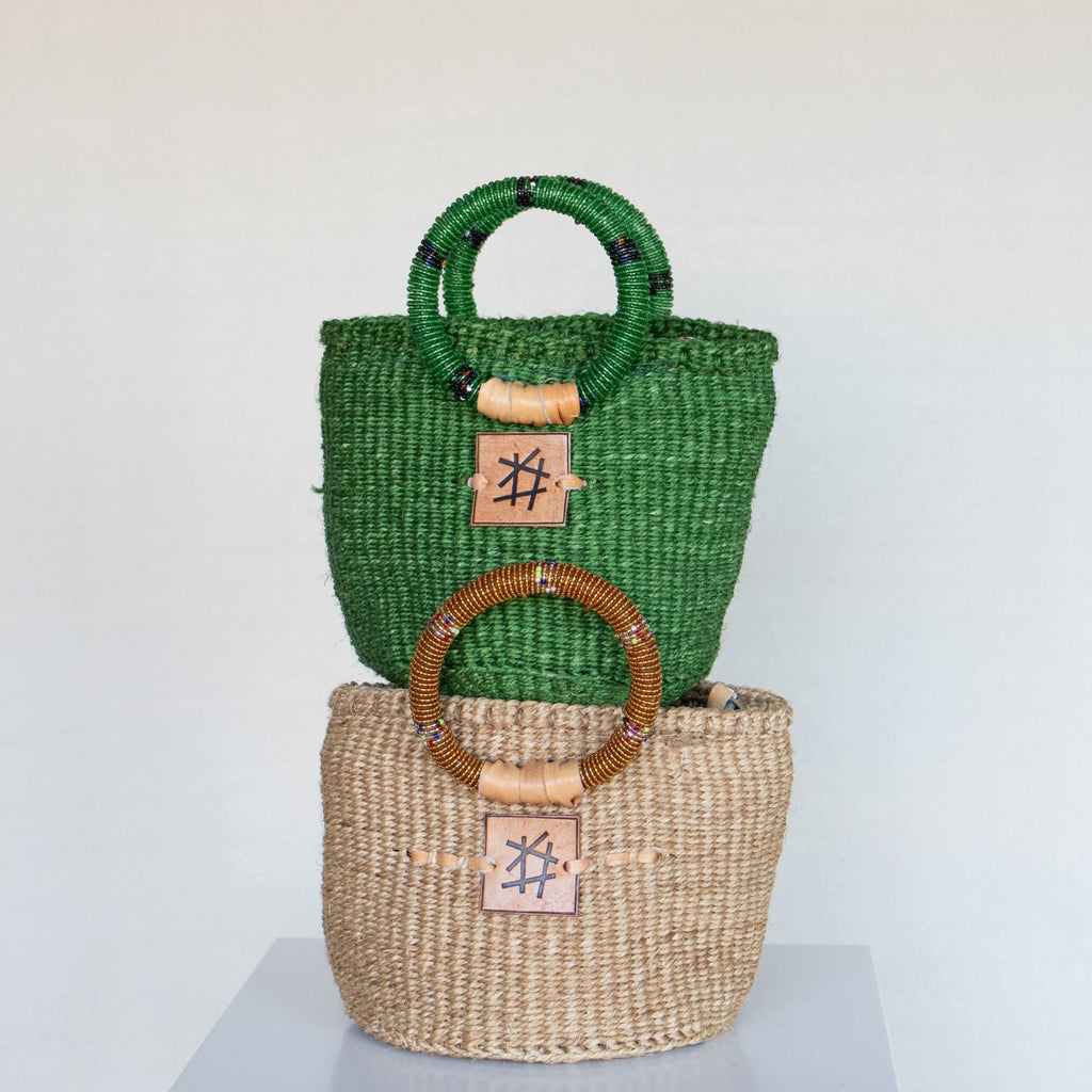 Liten veske med perlehåndtak