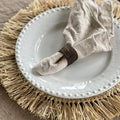 Placemat with fringed edge in natural
